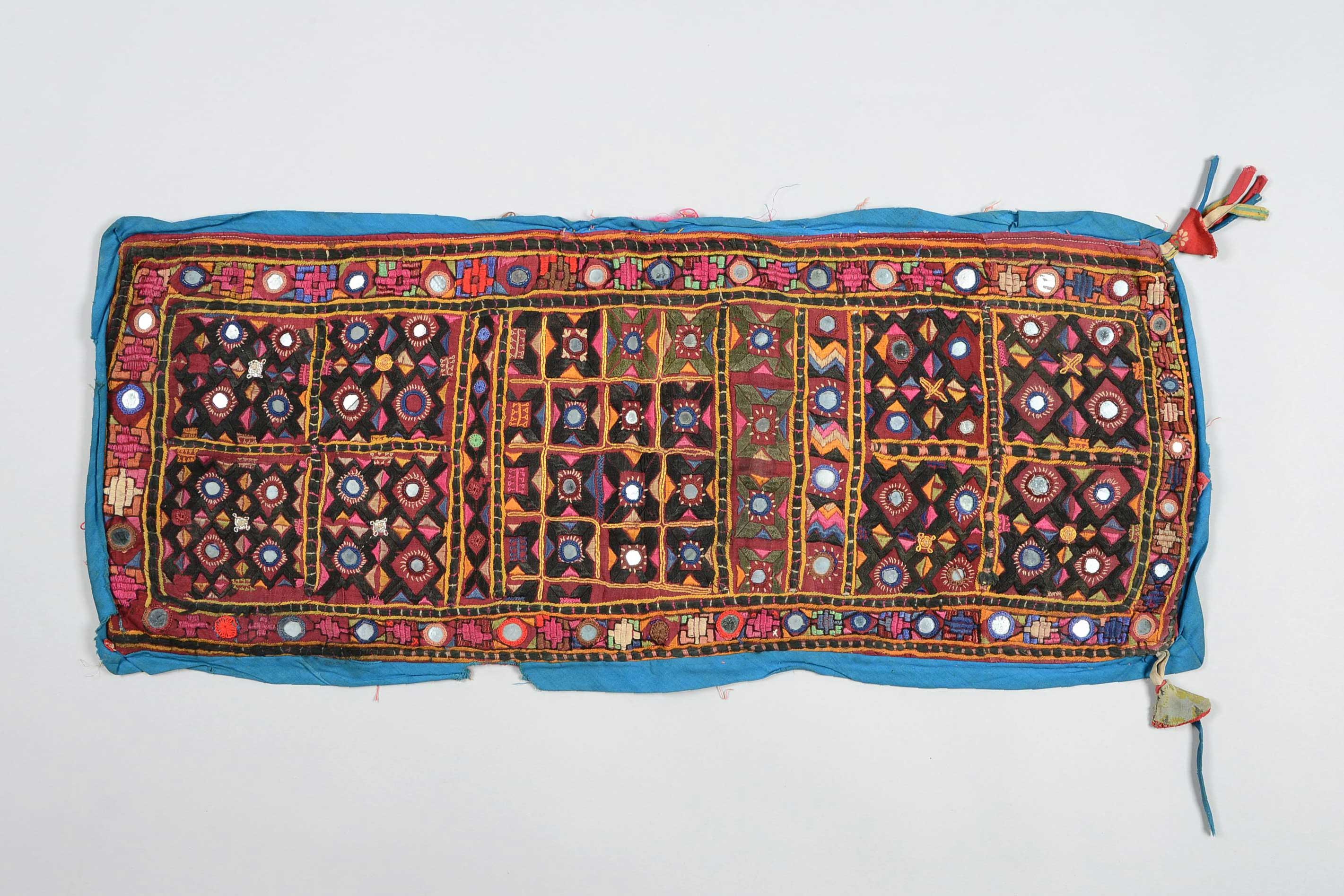Textile with mirror embroidery