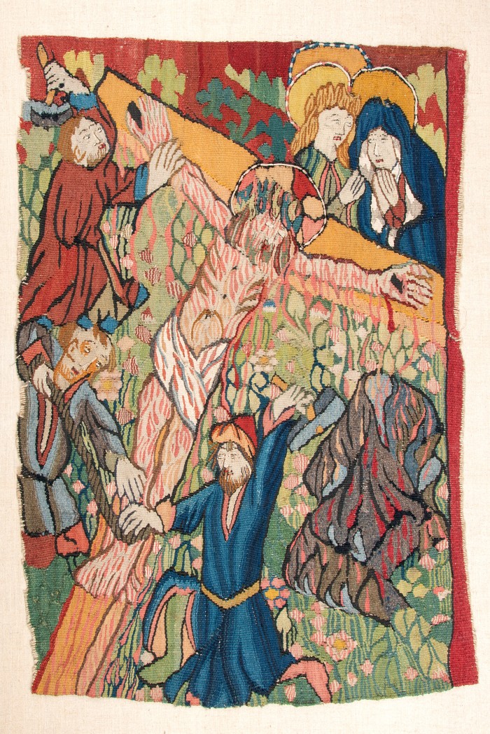 Tapisseriefragment mit Kreuznagelung als Motiv