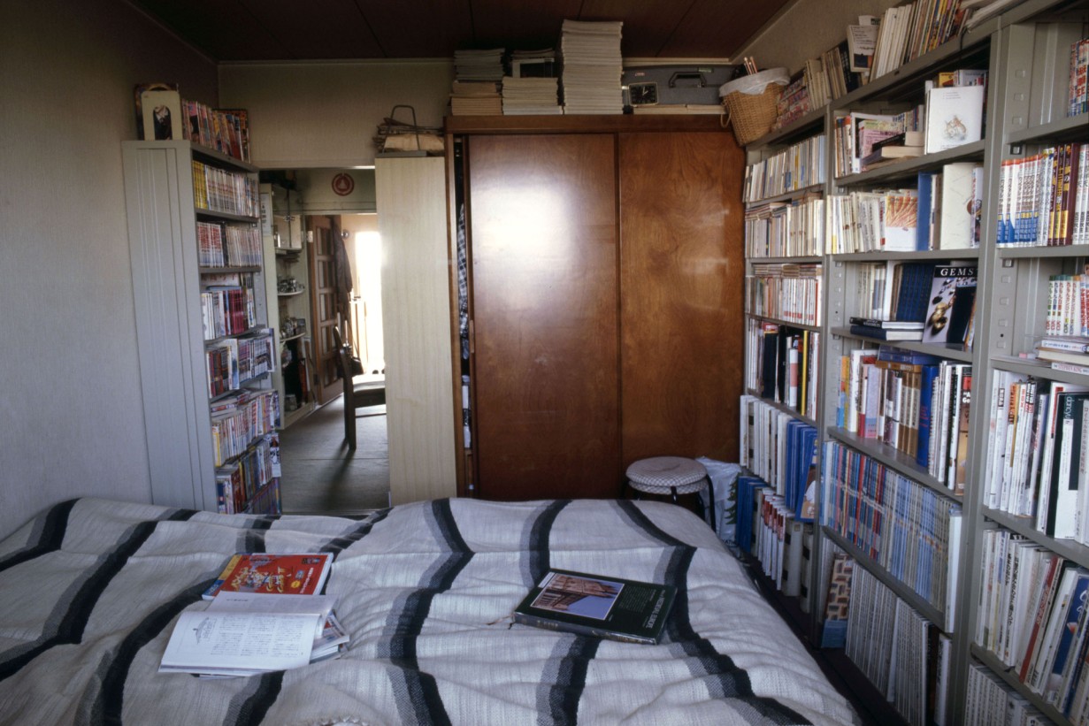 A bed with a book on it that creates a cozy reading atmosphere. 