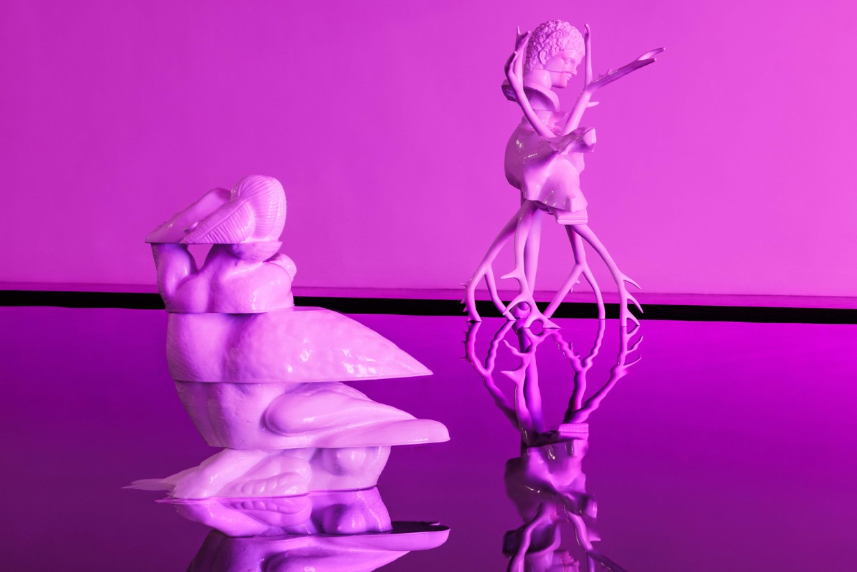 Water surface with two sculptures 