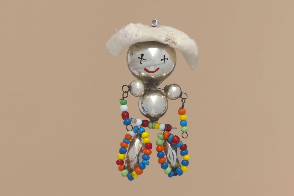 Christmas tree decoration made of beads, hollow spheres, wire, and felt in shape of a bead person