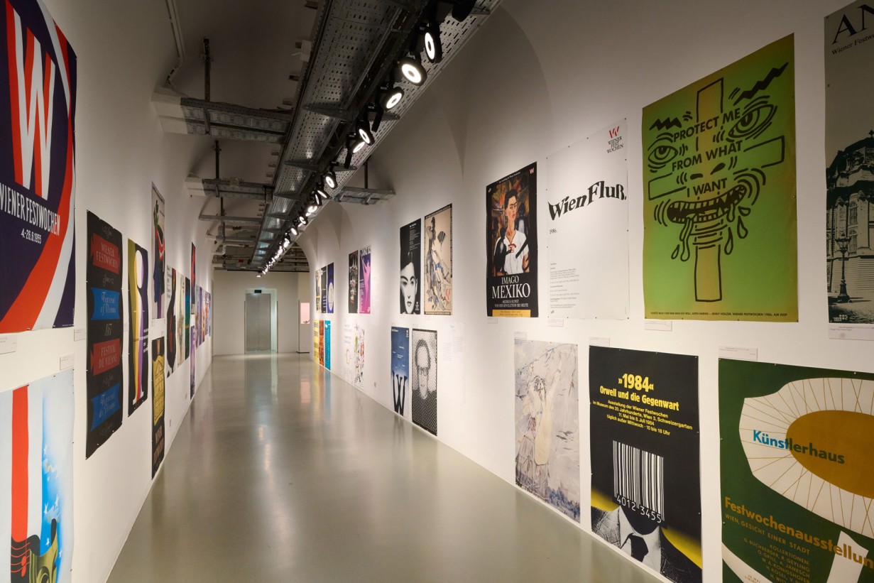 A hallway with Vienna Festival posters on the walls