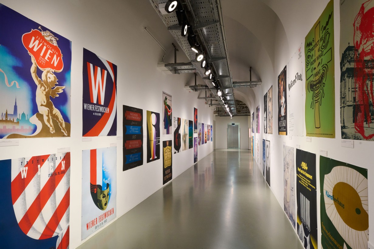 A hallway with Vienna Festival posters on the walls