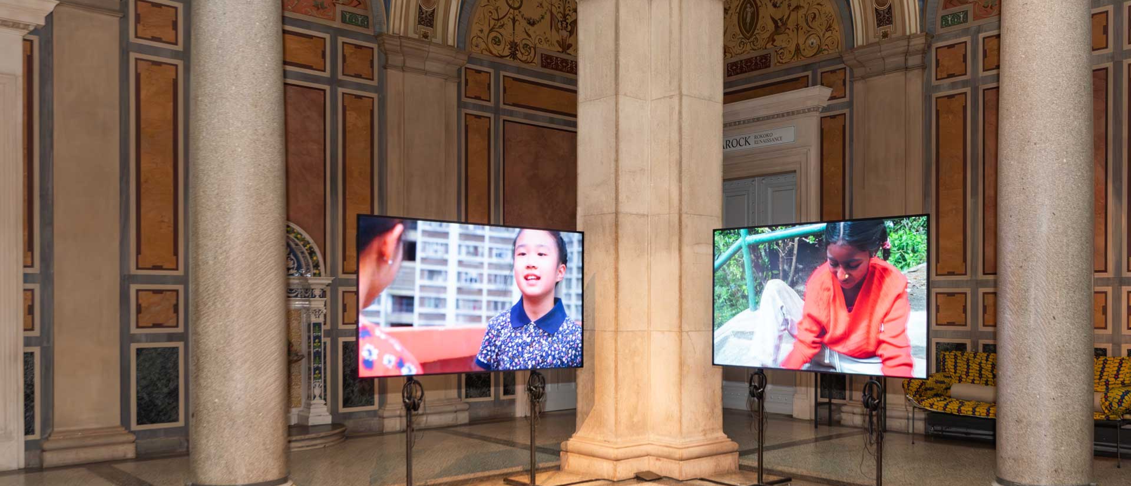 2 screens in the MAK Columned Main Hall