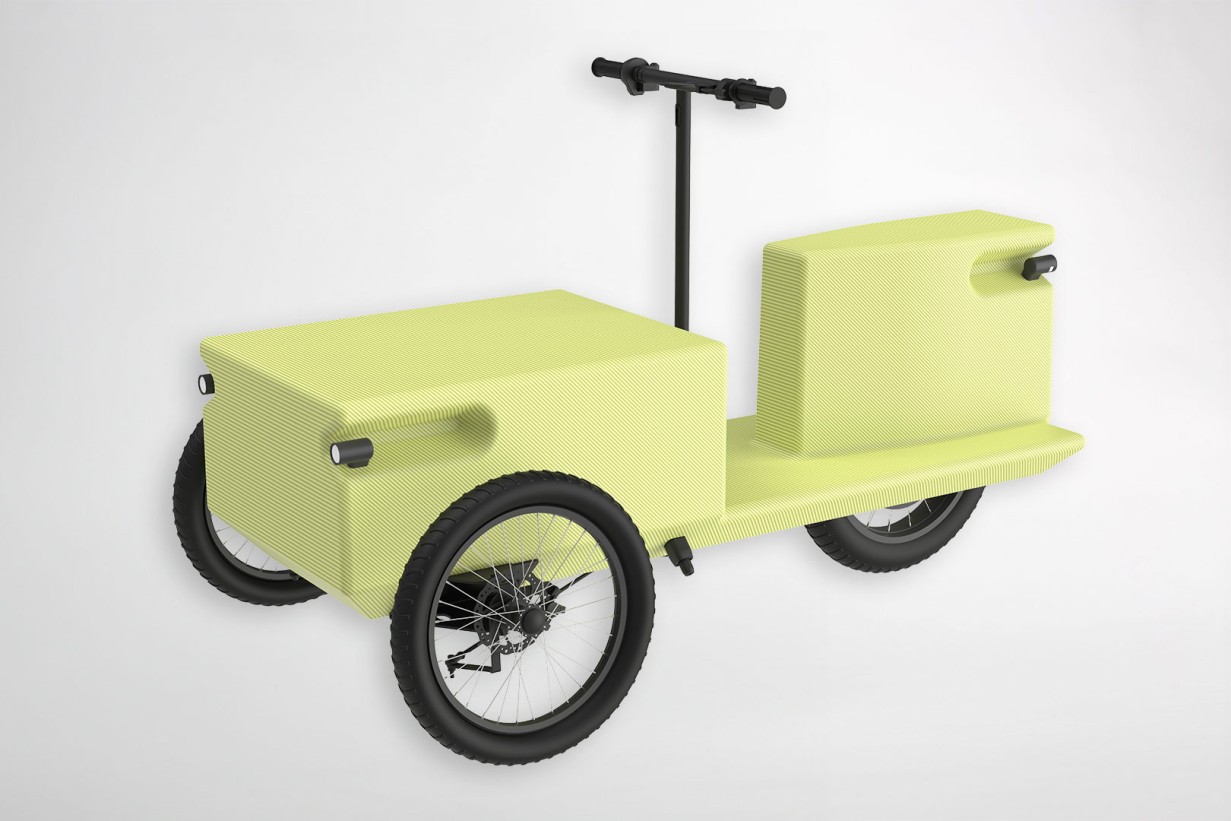 A yellow bicycle with a small box on the carrier, ready for a ride or delivery.