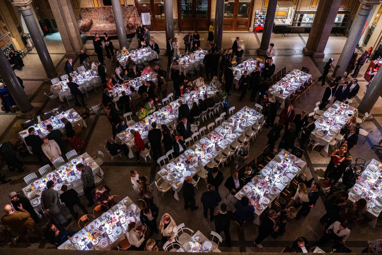 People eat in a festively decorated hall