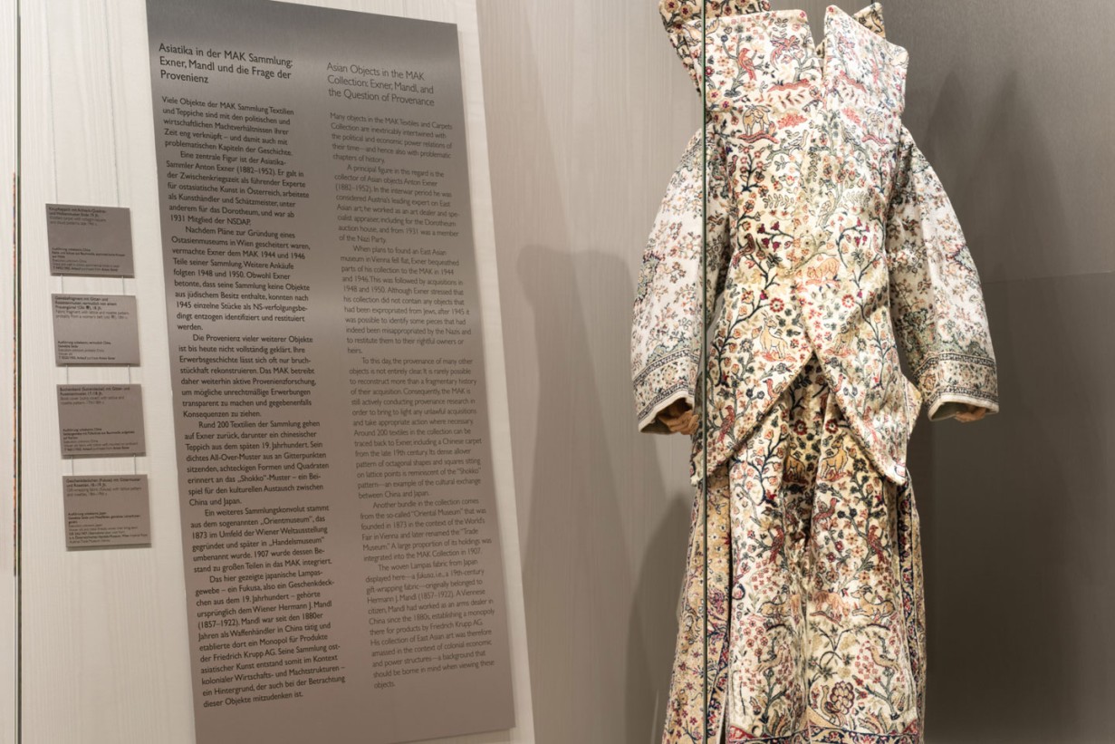 Display case with a dress made of carpet