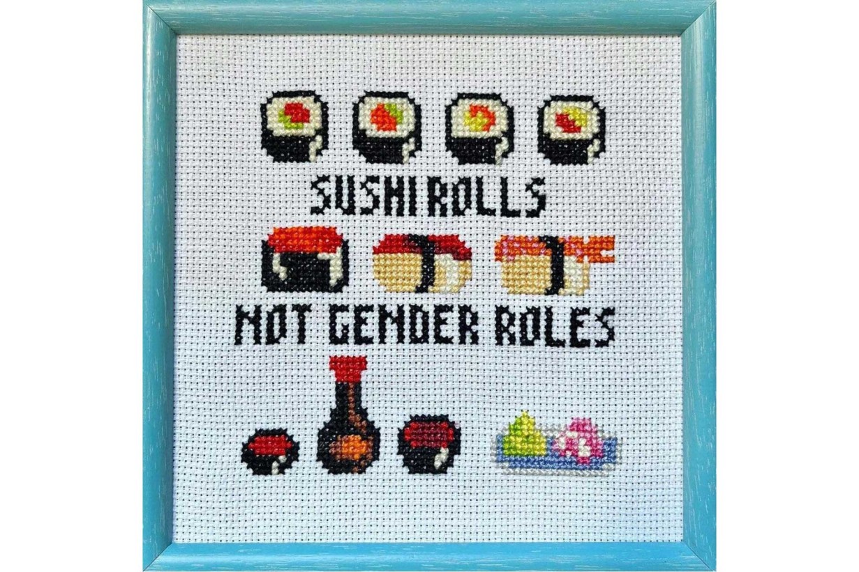 Cross-stitch object with small sushi rolls, text: "Sushi Rolls, not Gender Roles"