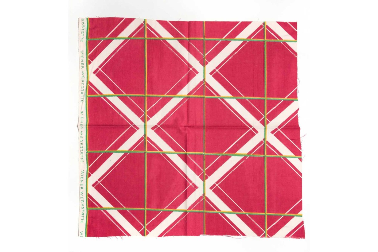 reddish geometric pattern. Fabric sample