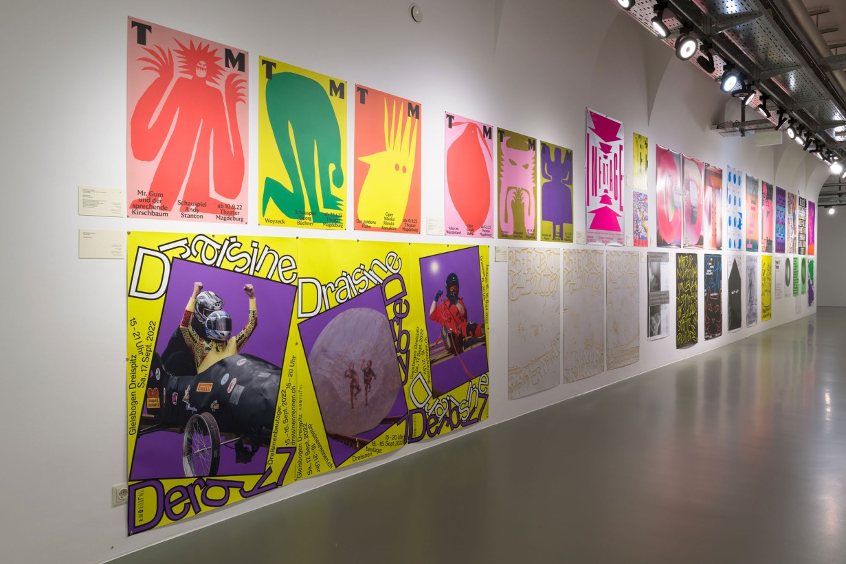 Exhibition Space with colorful posters on the wall 