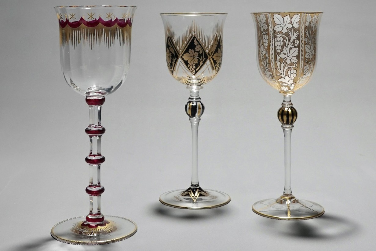 Three wine glasses made of colorless crystal glass with enamel and gold decoration on Kuppa