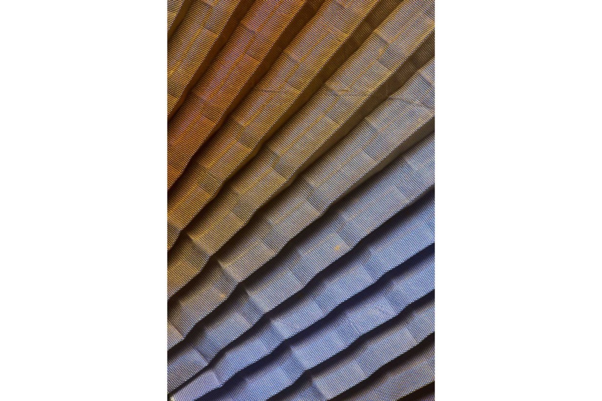 Fabric, pleated, stitched; metal hoop with gradient pattern