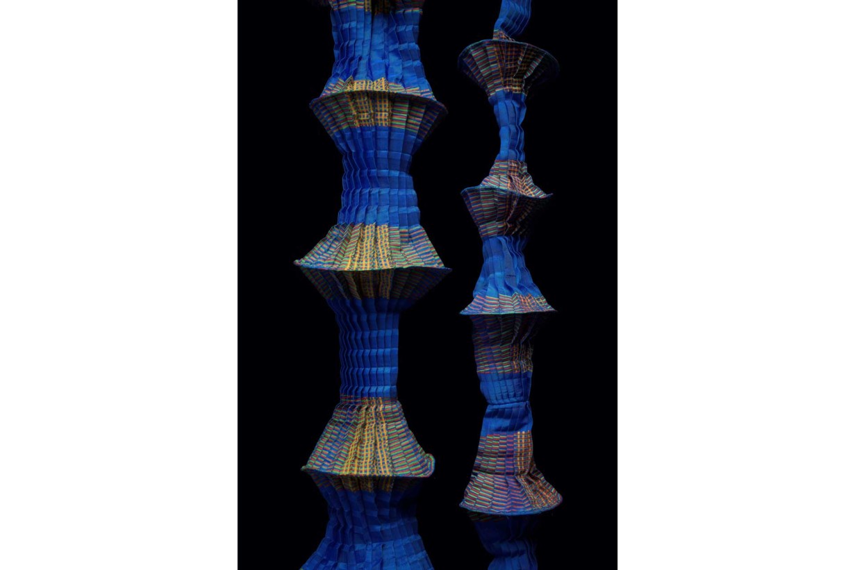 Synthetic fiber, pleated, printed; fishing line artfully draped in shades of blue