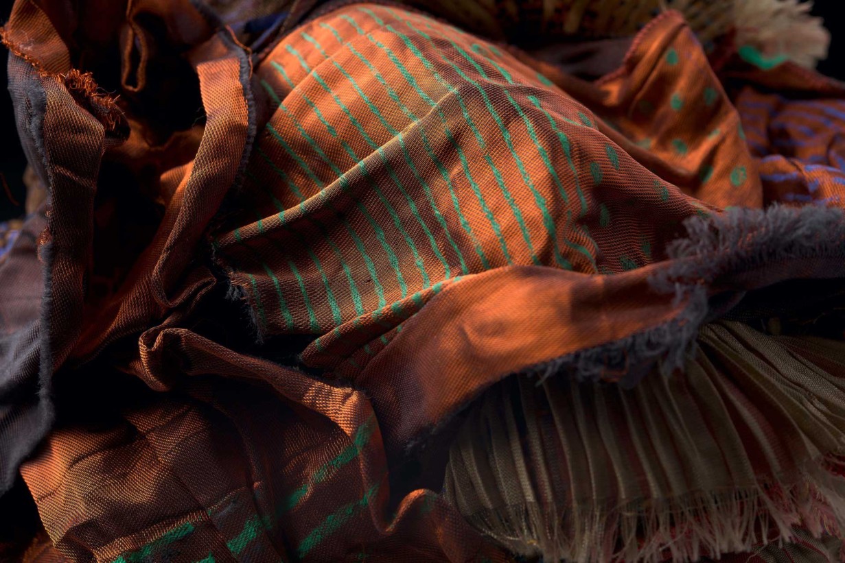 Synthetic fiber, printed, sewn in autumn colors arranged like piles of leaves