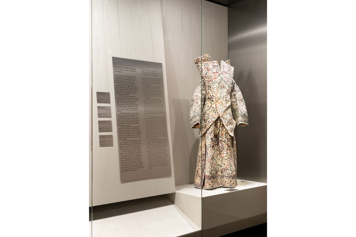 Display case with a dress made of carpet