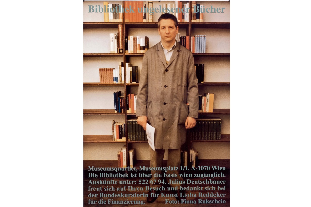 Julius Deutschbauer stands in front of a bookshelf.