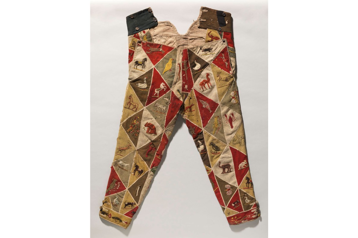 Harlequin trousers beige, red, green with small embroideries of birds, camels, horses, rabbits and frogs. 