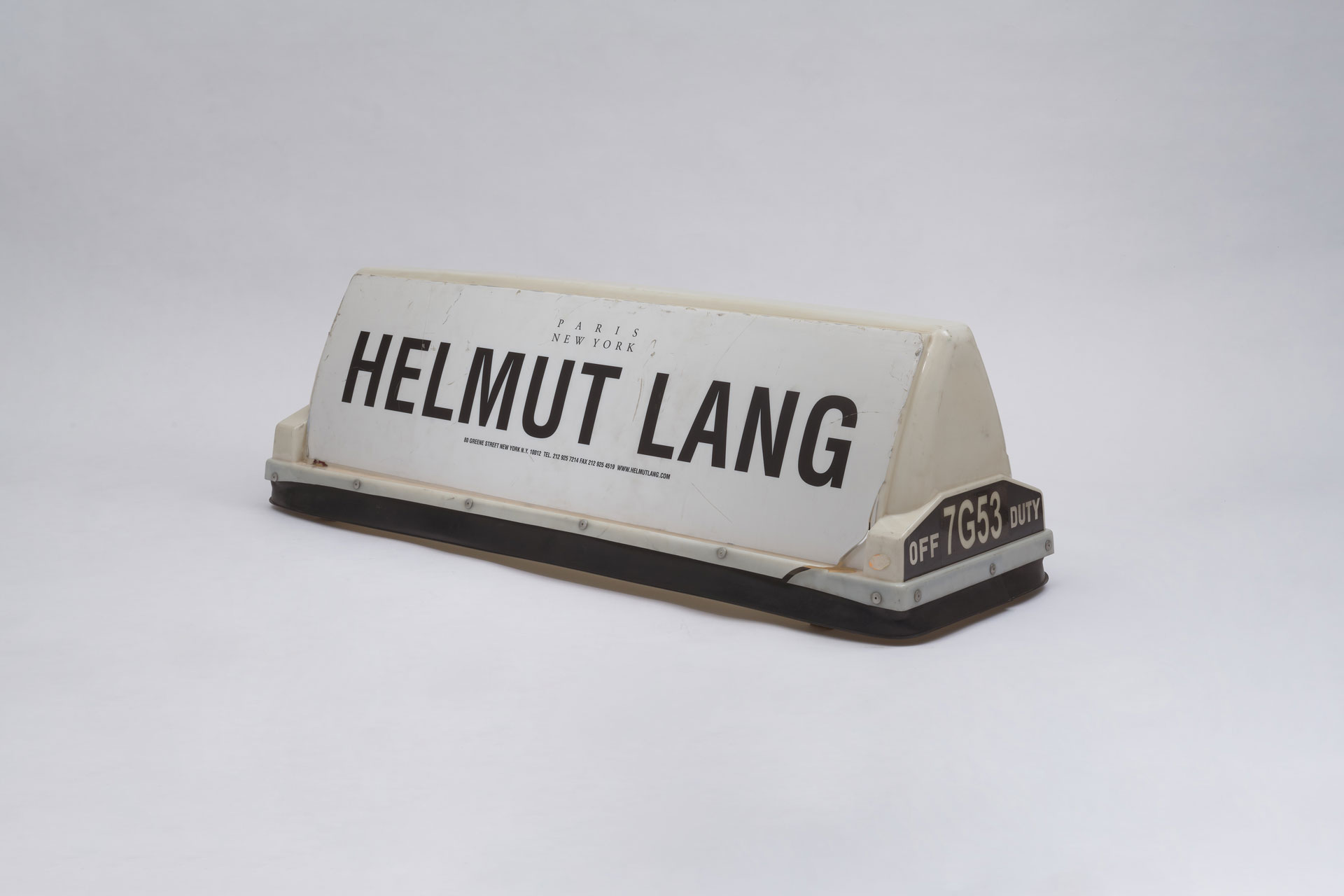 New York taxi top with HELMUT LANG lettering